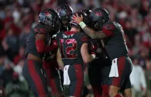 Nov 11, 2023; Norman, Oklahoma, USA; Oklahoma Sooners wide receiver Drake Stoops (12) celebrates with teammates after scoring a touchdown during the second half against the West Virginia Mountaineers at Gaylord Family-Oklahoma Memorial Stadium. Mandatory Credit: Kevin Jairaj-USA TODAY Sports