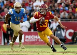 Home 13 Nov 18, 2023; Los Angeles, California, USA; USC Trojans quarterback Caleb Williams (13) scrambles during the third quarter against the UCLA Bruins at United Airlines Field at Los Angeles Memorial Coliseum. Mandatory Credit: Jason Parkhurst-USA TODAY Sports