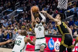 Home 7 Dec 19, 2023; San Francisco, California, USA; Golden State Warriors forward Dario Saric (20) defends Boston Celtics forward Jayson Tatum (0) during the second half at Chase Center. Mandatory Credit: John Hefti-USA TODAY Sports