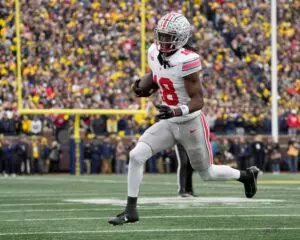 Home 13 Ohio State Wide Receiver Marvin Harrison Jr (18) running towards the sideline at Michigan Stadium. (Nov. 25, 2023)