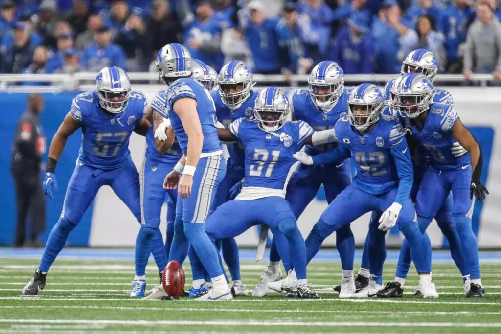 Detroit Lions special teams huddle and cheer as punter Jack Fox gets ready to kickoff against the L.A. Rams during the first half of the NFC wild-card game at Ford Field in Detroit