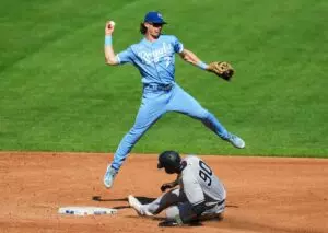 Home 5 Kansas City Royals shortstop Bobby Witt Jr. (7) throws to first base after forcing out New York Yankees center fielder Estevan Florial (90) during the third inning at Kauffman Stadium.