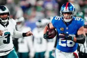 Home 6 New York Giants running back Saquon Barkley (26) heads to the goal line in the second quarter past Philadelphia Eagles linebacker Nolan Smith (3), Sunday, January 7, 2024.