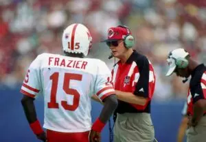 Home 5 Nebraska Cornhuskers head coach Tom Osborne talks to quarterback Tommie Fraizer during the 1994 season at Giants Stadium.