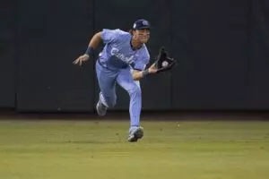 North Carolina Tar Heels outfielder Vance Honeycutt (7) makes a running catch against the Louisiana State Tigers in the eighth inning of the Div. I NCAA baseball regional at Boshamer Stadium. 