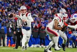 Home 10 New England Patriots quarterback Drake Maye throws pass in game against the Buffalo Bills.