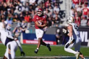 Home 11 Oklahoma Sooners quarterback Michael Hawkins Jr. (9) throws a pass during the Armed Forces Bowl football game between the University of Oklahoma Sooners (OU) and the Navy Midshipmen at Amon G. Carter Stadium in Fort Worth, Texas,