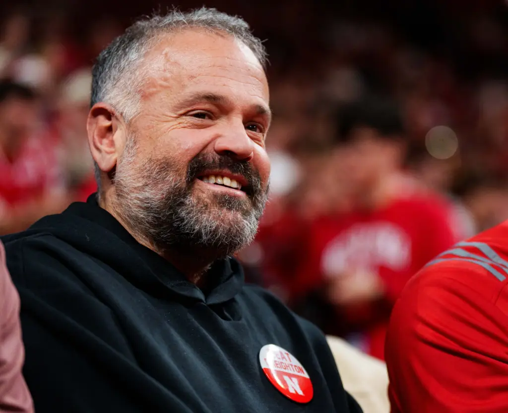 Nebraska Football Top 5 Toughest Games in 2026 Season 3 Nebraska football head coach Matt Rhule smiles while sitting on the sideline at the Nebraska-Creighton basketball game at Pinnacle Bank Arena in Lincoln, NE