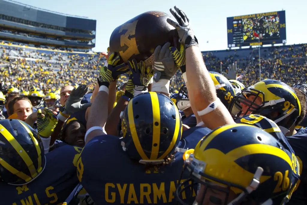 Michigan lifting the little brown jug
