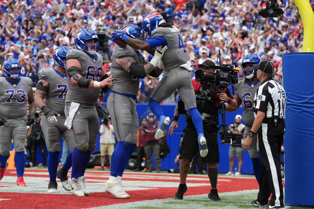 James Cook III celebrates scoring a touchdown during the fourth quarter against the Los Angeles Chargers. The Buffalo Bills are one of the five 3-0 NFL teams in the league. Are they legit contenders?
