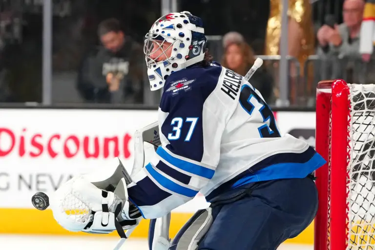 Home 1 One of the top NHL trade targets, Connor Hellebuyck, warms up before the start of a game.