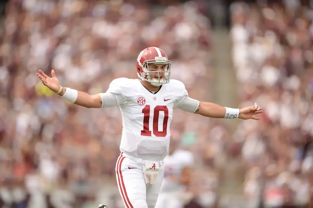 A.J. McCarron celebrates throwing a touchdown against the Texas A&M Aggies. Is McCarron one of Alabama's top quarterbacks of the last 15 years?