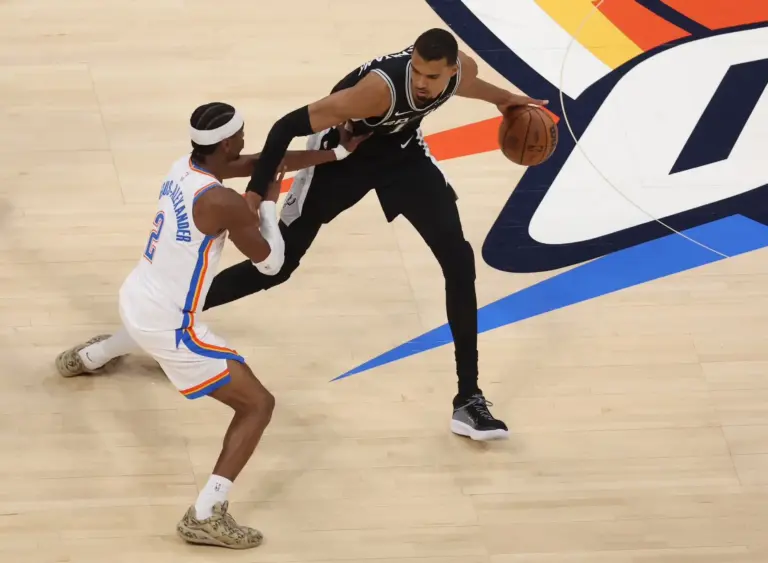 Victor Wembanyama dribbles against Shai Gilgeous-Alexander during Game 5 of the Western Conference Finals. Which player do you think plays in a tougher division? Check out our NBA power rankings by division for the 2026-2027 season.