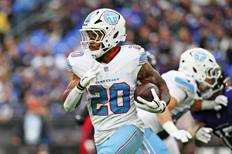 Home 2 Tony Pollard runs the ball against the Baltimore Ravens at M&T Bank Stadium. Pollard trade rumors seem to be heating up as teams around the league are beginning to deal with injuries. Could the Titans running back be on the move?