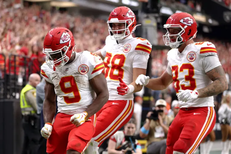 Home 1 Kenneth Walker III celebrates with teammates after scoring a touchdown against the Las Vegas Raiders. Walker is a big reason why the Chiefs' new offensive identity is causing headaches for defensive coordinators.