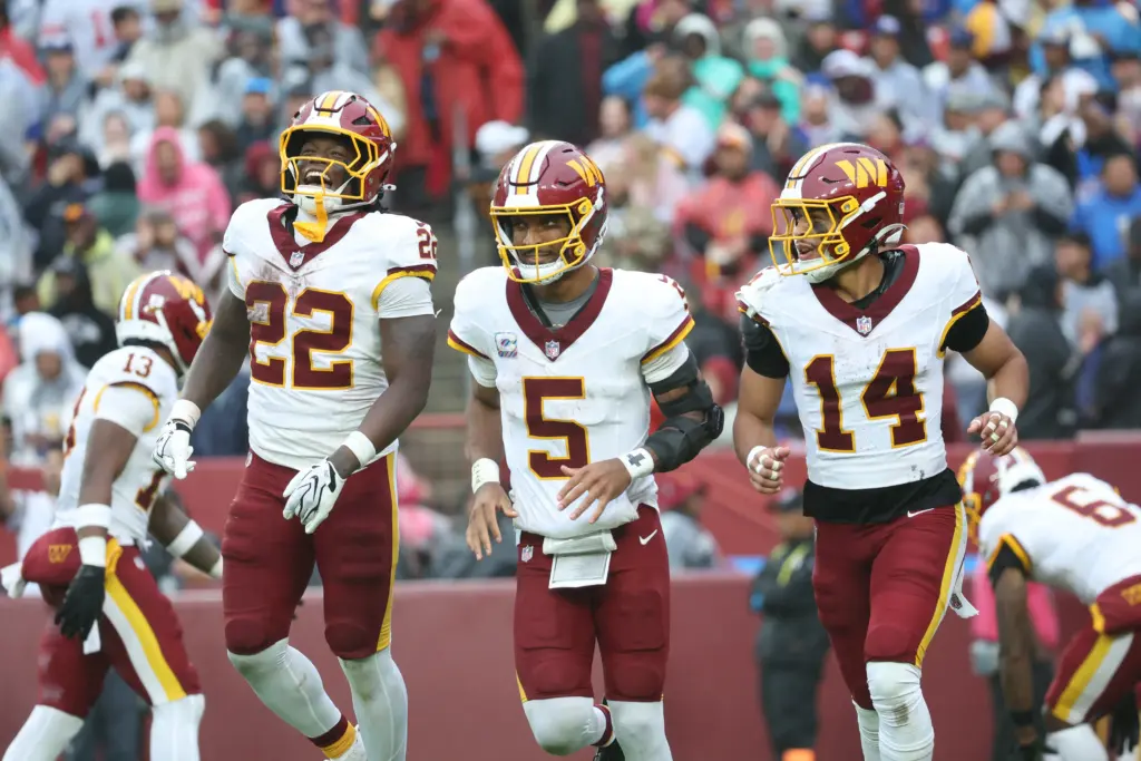 Jayden Daniels celebrate touchdown against Giants 