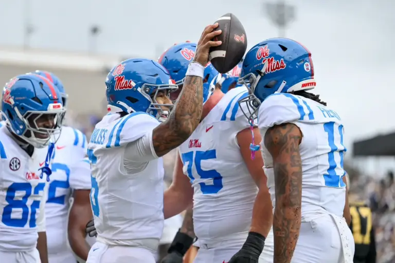 Home 1 Trinidad Chambliss celebrates with his teammates after scoring a touchdown. Ole Miss is one of the AP Top 25 teams that faces a must-win game in Week 7.
